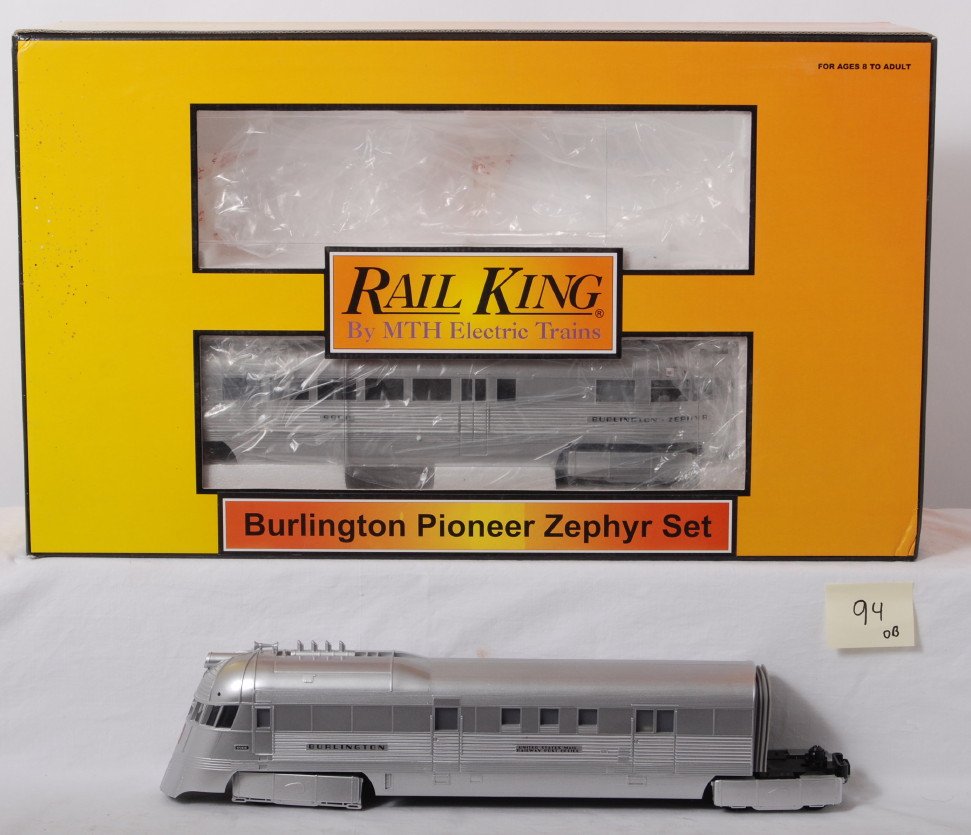 MTH Railking Burlington Pioneer zephyr: MTH Railking modern O Gauge Burlington Pioneer Zephyr in OB. Catalog number is 30-2186-1. Set features Protosound. Set is C8 with run time. OB has some light staining on face.