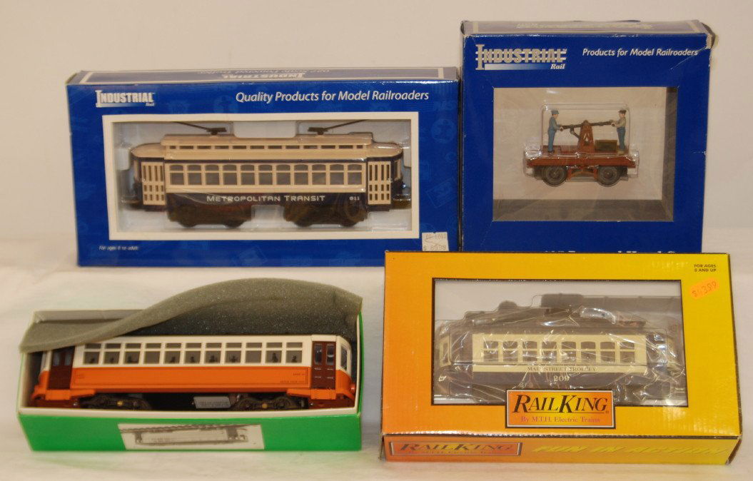 4 O gauge motorized units, trolley, hand car, etc: Modern O Gauge motorized units in OBs. Includes Industrial 14002 Metro trolley, Industrial 10000 hand car, MTH 30-2562 Main Street trolley, and Bowser 551-50126 Brill Trolley. Items are generally C8.
