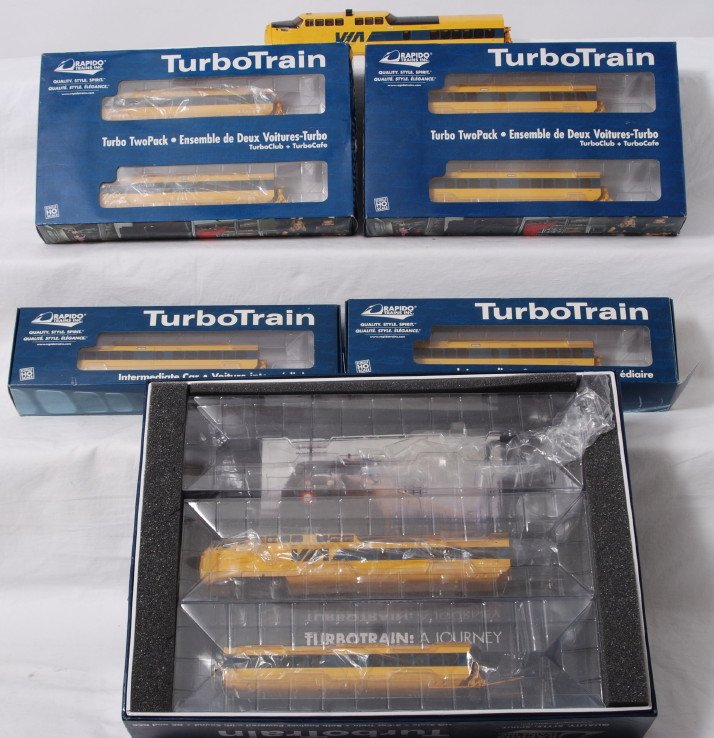Rapido HO VIA turbo train set and add ons: Rapido modern HO VIA Turbo Train set in OBs. Includes 200006 - Two Power Dome cars and 1 Intermediate car, 200601 - IC-30/35 Turbo Coach #256, 200602 - IC-30/35 Turbo Coach #261200603 - IC-33 TurboClu