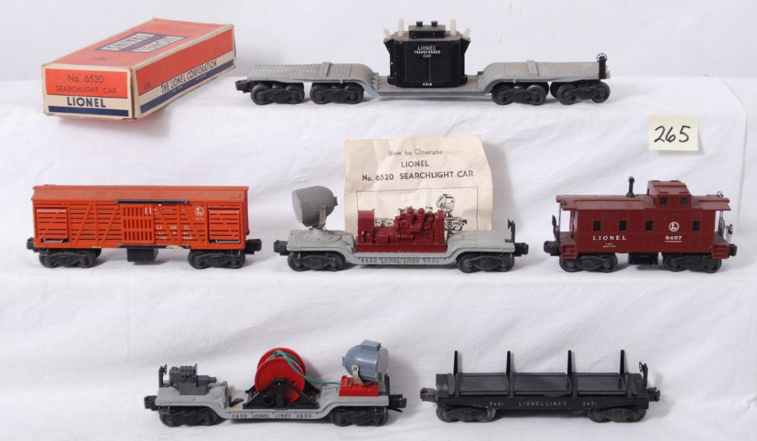 Lionel 6520 in OB, 6518, 3650, 3451, 3656, 6457: Postwar Lionel O gauge 6520 searchlight car in OB, 6518 depressed center flatcar, 3650 extension searchlight car, 3451 automatic dump car, 3656 stockcar, 6457 caboose, C5-6 with repainting 3451. 6520