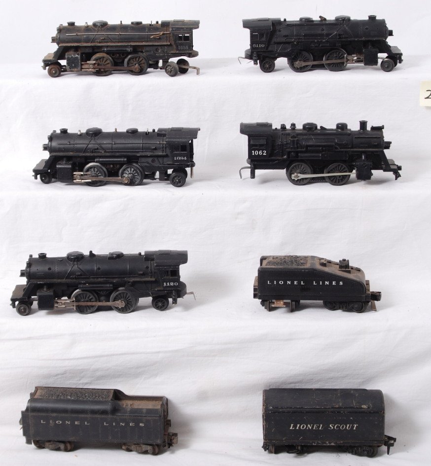 Lionel steam locomotives and tenders, eight total: Postwar Lionel O gauge 1684, 1655, 1120, 6110, 1062 steam locomotives and three unnumbered tenders without whistles. One tender is missing a step, otherwise trains look C5-6.