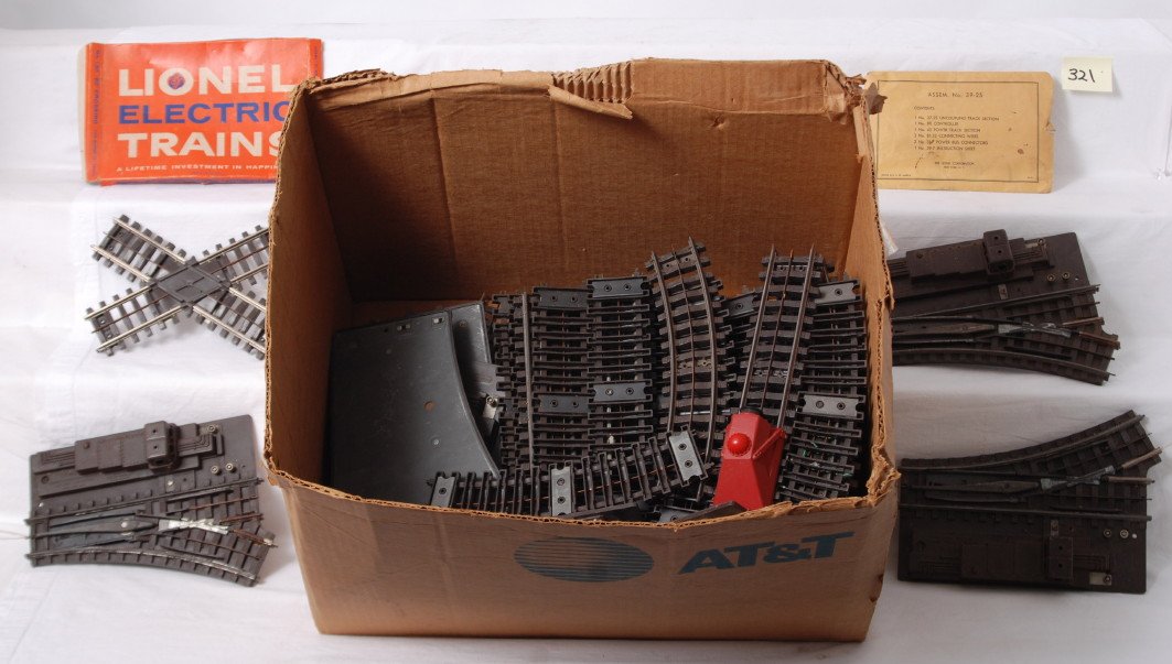 Large Lionel Super O track and switches lot: Postwar Lionel O gauge, Super O track and switches with one box and a 39-25 components envelope. Some items have rust and oxidation, some chipping, cracking, etc. Some track is very clean and shiny. 3