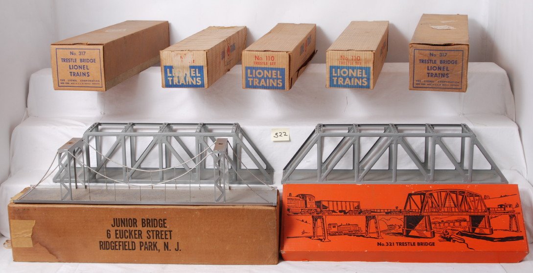 Lionel 110 x3, two 317, 321, and Junior Bridge in : Postwar Lionel O gauge 3212 trestle bridge, three 110 trestle sets, two 317 trestle bridges and a Junior Bridge, all in original boxes, C6-7. 110 trestles may or may not be complete. Boxes are square 