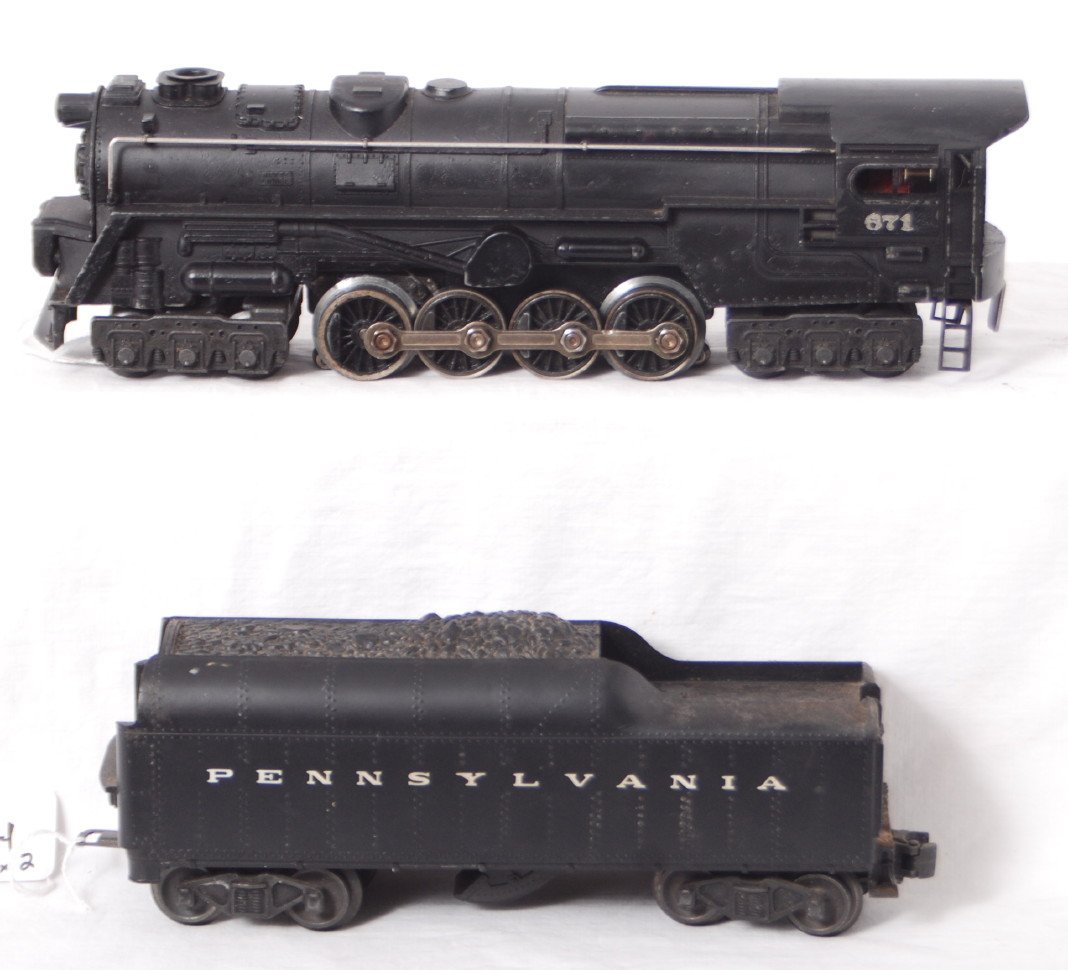 Lionel 671 steam loco and 2046W-50 PRR tender: Postwar Lionel O gauge 671 steam locomotive and 2046W-50 Pennsylvania whistle steam tender. Loco has some touchups. Train looks C6.
