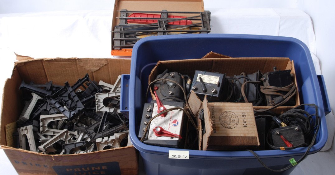 Sixteen gallon tote full of small transformers: Numerous prewar and postwar, American Flyer, Lionel, Jefferson, and possibly other smaller transformers, some in original boxes. Trestle pieces, track, and more included. Clean and usable lot. Please 