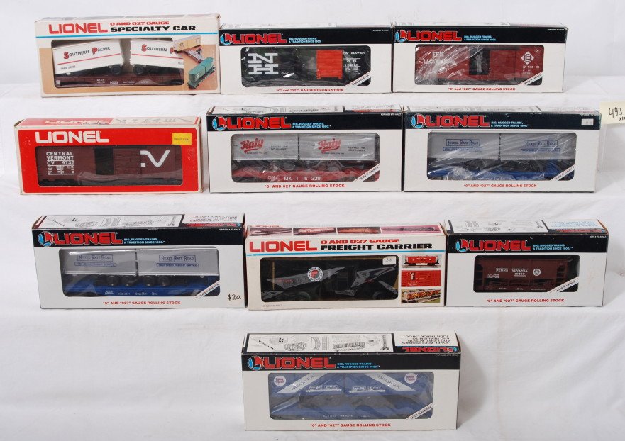 10 Lionel freight cars 19218, 9268, 16314, etc: Lionel modern O gauge freight cars in OB. Ten freight cars include 9333 Southern Pacific flat with trailers, 9737 Central Vermont boxcar, 19809 Erie Lackawanna operating boxcar, 19218 New Haven boxcar