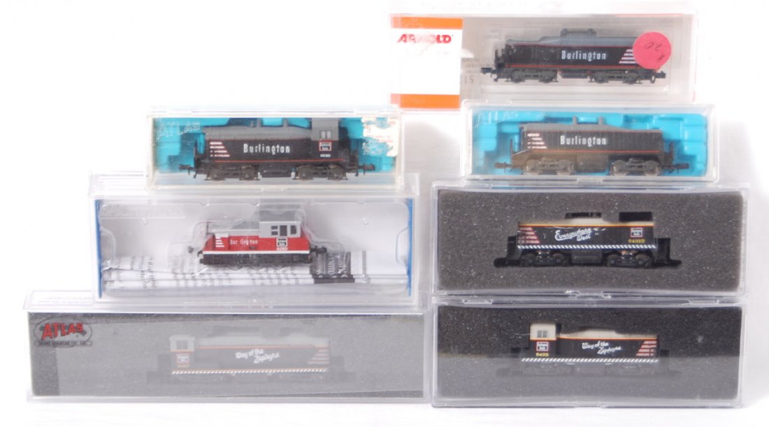 7 Burlington N scale diesel locomotives: Modern N scale Burlington diesel locomotives in OBs. Seven locos include 60066 Bachmann Plymouth, 5121 Arnold calf unit, Atlas 4005 and 4015 SW 1500 cow and calf, Atlas 51006 VO-1000, and Con Cor 0001