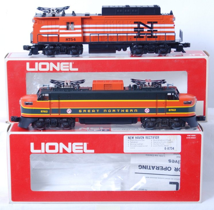 Lionel 8754 NH Rectifier and 8762 GM electric in O: Modern era Lionel O gauge 8754 New Haven Rectifier electric locomotive and 8763 Great Northern EP-5 electric locomotive, in original boxes, trains look better but are graded C8 due to having been run.