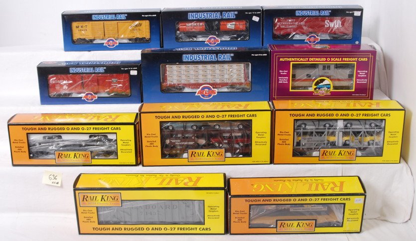 11 Railking and Industrial Rail freight cars: Modern O gauge freight cars from Railking, MTH, and Atlas Industrial Rail. MTH cars include 7694 auto carriers with Novas, 76155 Union Pacific flat car, 7533 Seaboard hopper, 7638 auto carrier with Fi