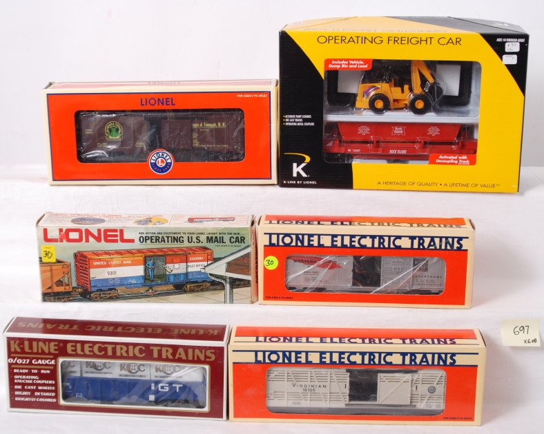 6 Lionel and K line freight cars: Lionel and K line freight cars in OBs. Includes 52378 TTOS Las Vegas boxcar, 9301 operating mail car, 16125 Virginian stock car, 52009 TTOS Western Pacific boxcar, K90005IC gondola with crates, and 21