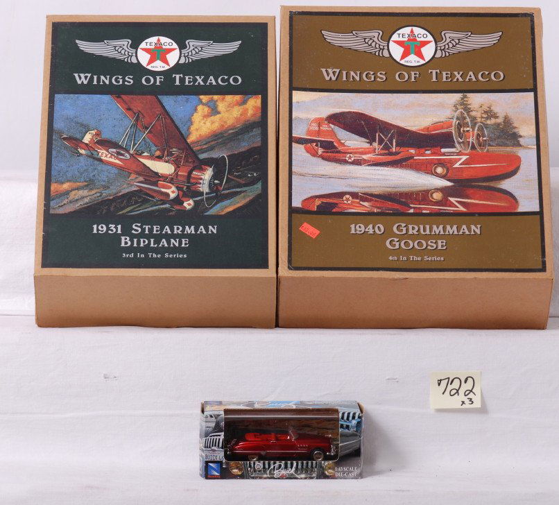 Ertl ÒWings of TexacoÓ die cast airplanes in OB: Ertl Wings of Texaco die cast toy airplanes in original boxes, C9-10. 1940 Grumman Goose and 1931 Stearman Biplane. Also included is a New-Ray Toys Buick, 1:43 scale. Boxes show a little light wear.
