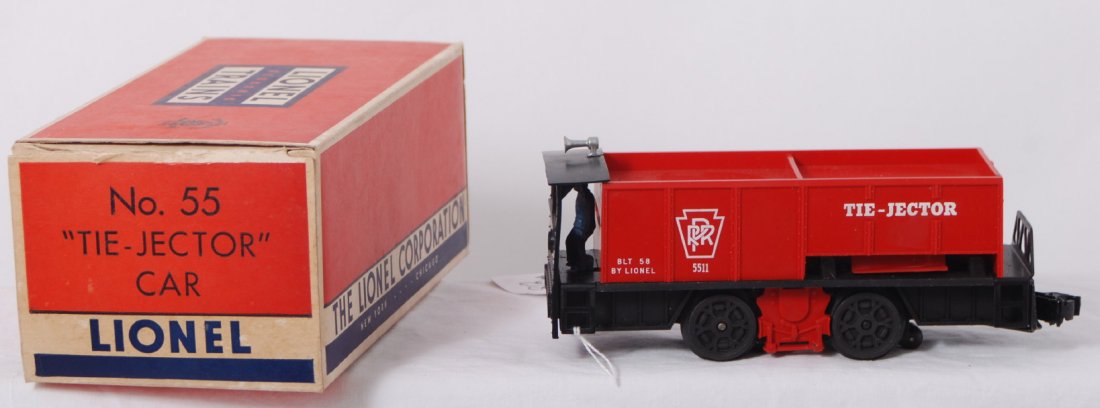 Lionel No. 55 Tie-Jector with slot behind driver i: Postwar Lionel O gauge No. 55 Tie-Jector car with tough slot behind driver variation in original box, test run C9. Box has old price sticker, minor tears in tuck flap folds, includes insert, C8-9.