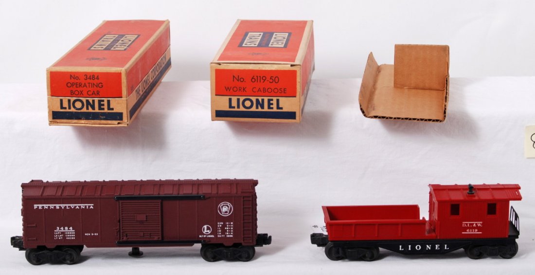 Lionel 3484 PRR op. boxcar & 6119-50 D.L.&W. caboo: Postwar Lionel O gauge 3484 Pennsylvania operating boxcar and 6119-50 Delaware, Lackawanna, and Western work caboose in original boxes, unrun C9-10. 4384 box missing tuck flap, square and solid. 6119-
