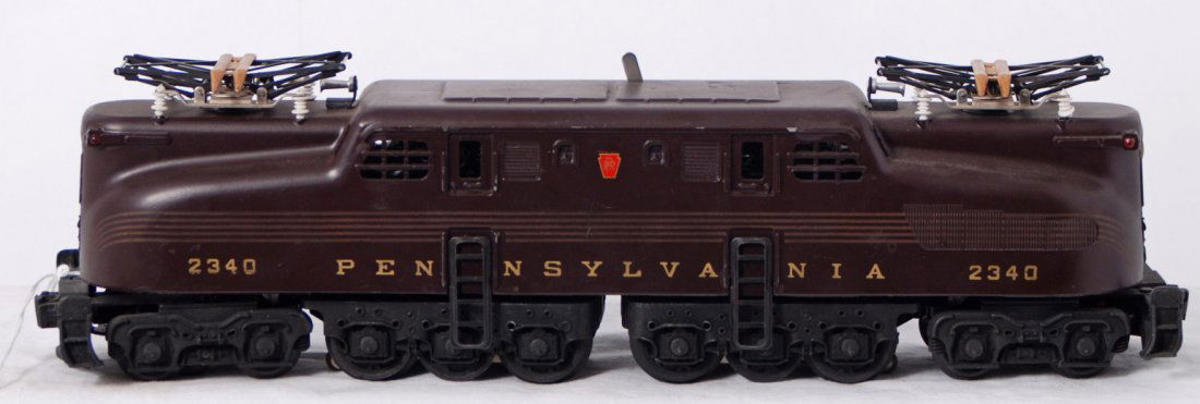 Lionel 2340 Tuscan Pennsylvania GG-1 electric: Postwar Lionel O gauge 2340 Tuscan Pennsylvania GG-1 electric locomotive with very nice and super even original stripes. Loco has some tiny touchups on roof, but still looks impressive C7 area with re