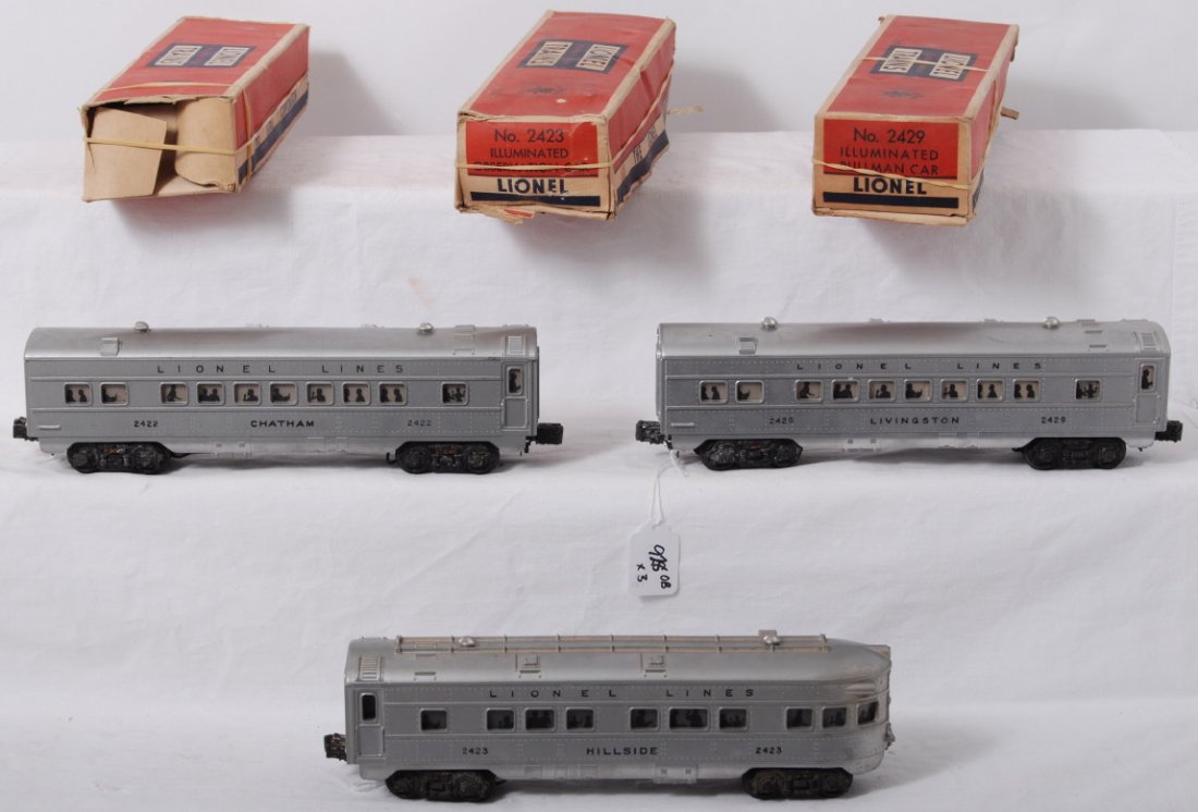 Lionel 2422, 2423, 2429 passenger cars in OB: Postwar Lionel O gauge 2422 Chatham Pullman, 2423 Hillside observation, and 2429 Livingston Pullman passenger cars, C6. Boxes have opened seams, missing flaps, staple repairs, etc.