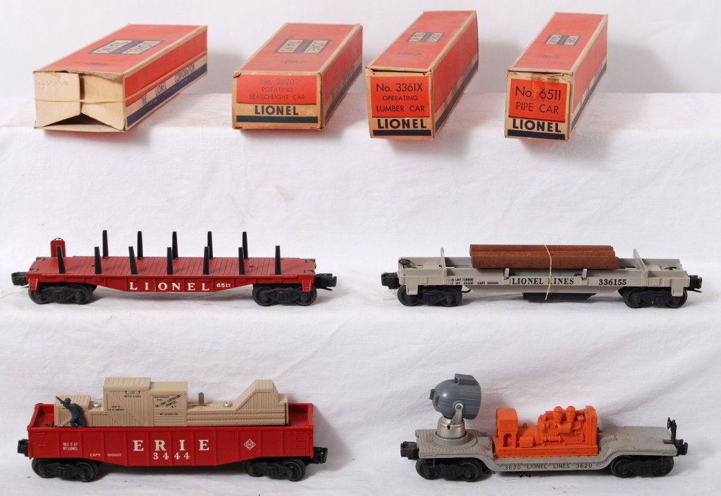 Lionel 3620, 3444, 3361, 6511 in OB: Postwar Lionel O gauge 3620 searchlight car, 3444 Erie animated gondola (small melt mark), 3361 operating lumber car, and 6511 pipe car (brick red missing one stake), in original boxes, C6-7. Boxes ha