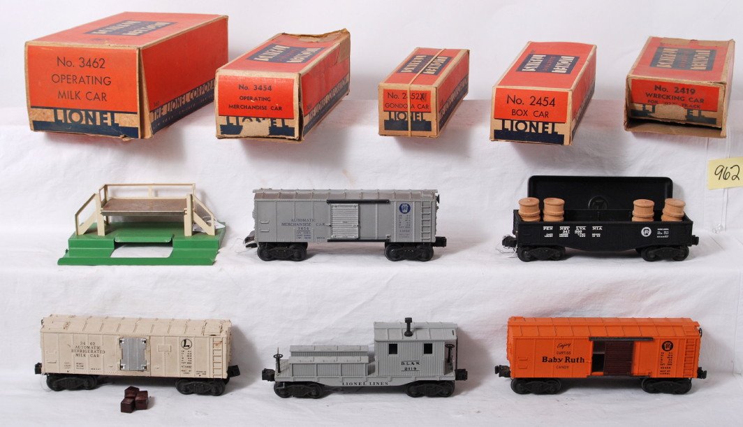 Lionel 3462, 3454, 2454, 2452, 2419, in original b: Postwar Lionel O gauge 3462 operating milk car, 3454 Pennsylvania operating merchandise car (with five crates and 160 bin), 2454 Pennsylvania Baby Ruth boxcar, 2452 Pennsylvania gondola car (with four