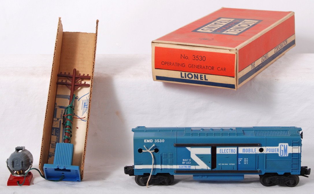 Lionel 3530 EMD Generator car in OB w/components: Postwar Lionel O gauge 3530 GM EMD operating generator car in original box with insert, instructions sheet, and searchlight and pole. Train has full stripe, light fading, C6-7. Box is C8 area.