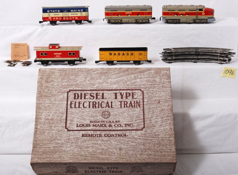 Marx No. 8935 diesel type electrical train in OB: Postwar Marx O gauge No. 8935 diesel type electrical train set in original box with inserts/dividers. Trains looks C7-8. Set box looks C7 area. Curved track and packing slip included. Monon 81F A unit