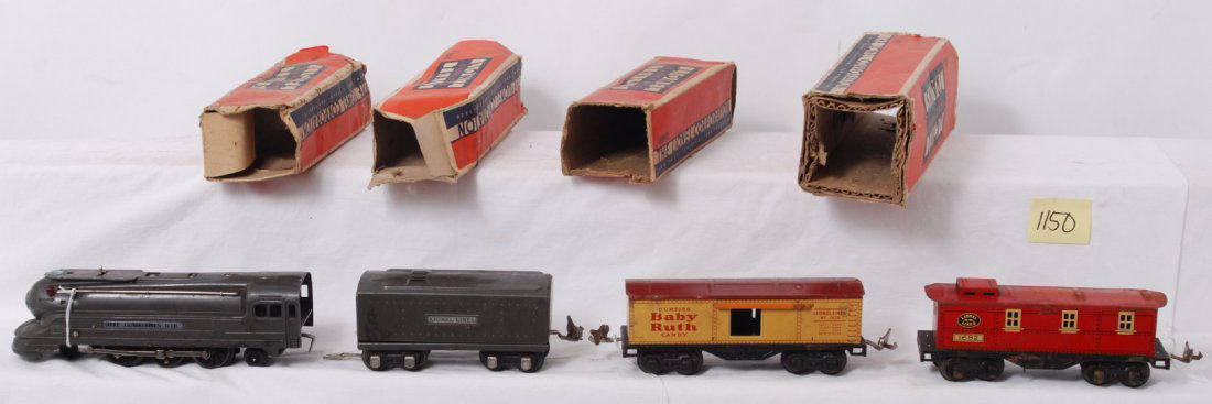 Lionel 1668, 1689T, 1679, and 1682 in OB: Prewar Lionel O gauge 1668 steam locomotive, 1689T tender, 1679 Baby Ruth boxcar, and 1682 caboose in original boxes. Loco has dented cab and oxidation, boxcar and caboose have rust. Please view the p
