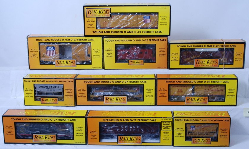 10 Railking freight cars Union Pacific and Erie: MTH Railking modern O gauge freight cars in OB. Ten freight cars include 74332 Union Pacific boxcar, 77009 Erie caboose, 73260 Union Pacific tank car, 75244 Union Pacific ore car, 74073 Union Pacific 