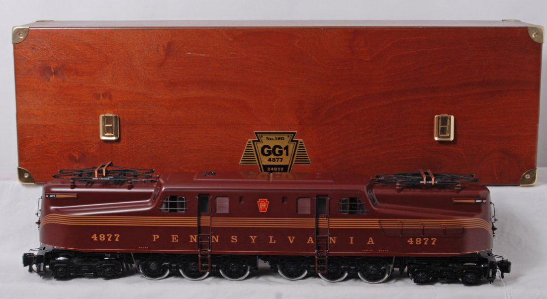 LGB 24832 Pennsylvania GG-1 4877 No. 120 in Box: Modern era LGB G scale 24832 Pennsylvania GG-1, five stripe Tuscan 4877 in original box, No. 120. Train looks better but is graded C8 due to very light run time. Box show light wear.