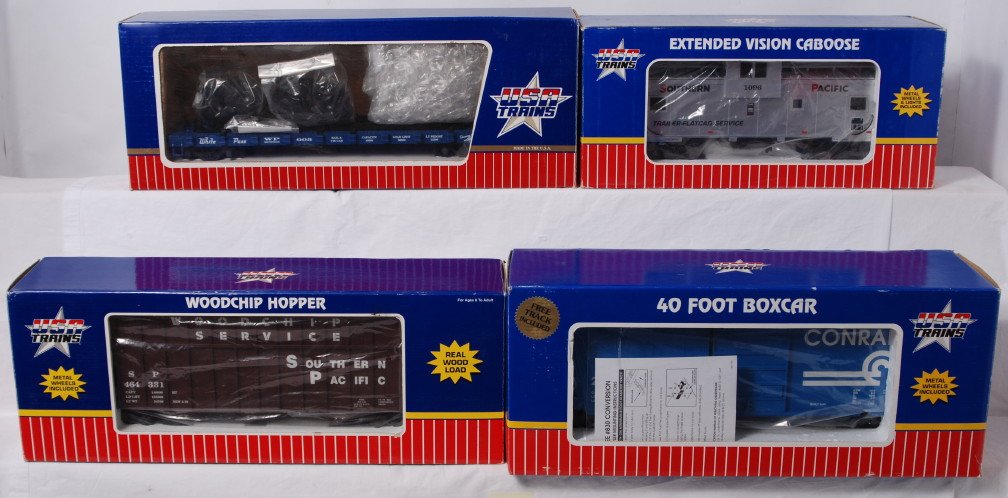 Four USA Trains G scale/Gauge 1 freight cars in O: Modern era USA Trains G scale/Gauge 1 freight cars in original boxes, C7-8. R14080 Southern Pacific woodchip car 464331, R-1888 White Pass wheel car, R19203B Conrail 40Õ PS-1 boxcar, and R12102 South