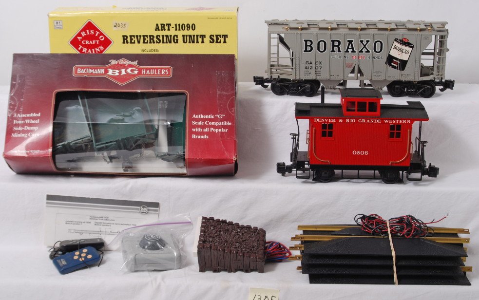G scale freight cars, track accessories, etc.: Modern era Aristo Craft Trains, Bachmann, Athearn, and Rapido, G scale/Gauge 1 freight cars, track accessories, and other items, some in original boxes. Items generally appear C6-8 except side dump ca
