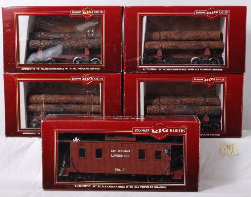 Bachmann 93830 caboose, four 98490 skeleton log c: Modern era Bachmann G scale/Gauge 1 freight cars, C5-7. Four 98490 skeleton log cars with logs, and 93830 8 wheel Ely Thomas Lumber Company center cupola wood caboose, all in original boxes. Boxes sho