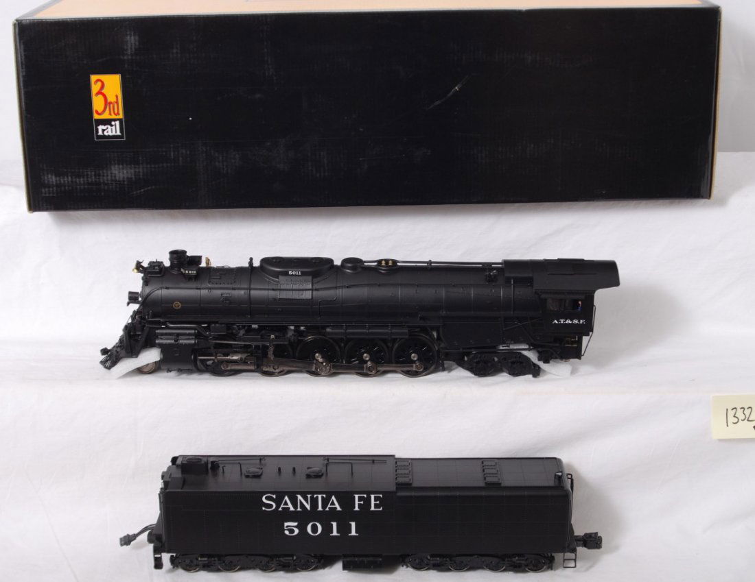 3rd Rail brass Santa Fe 2-10-4: 3rd Rail modern O Gauge brass Santa Fe 2-10-4 steam locomotive in OB. Cab number is 5011 and this is the three rail version. Loco feature smoke, TMCC, Railsounds and more. Loco is C8 however loco is m