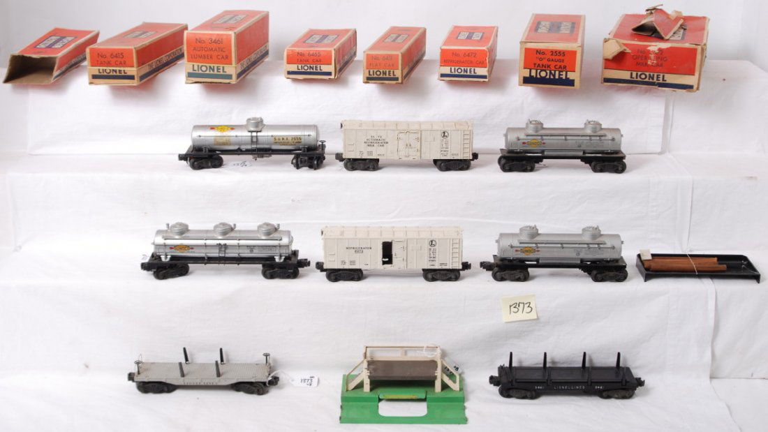 Lionel 2555, 3461, 3472, 6472, 6415, 6411, 6465,: Postwar Lionel O gauge freight cars in original boxes C5-6. Some boxes have missing flaps, tears, tape repairs, etc. Some boxes have inserts. 2555 Sunoco tank, 3461 automatic lumber car, 3472 milk car
