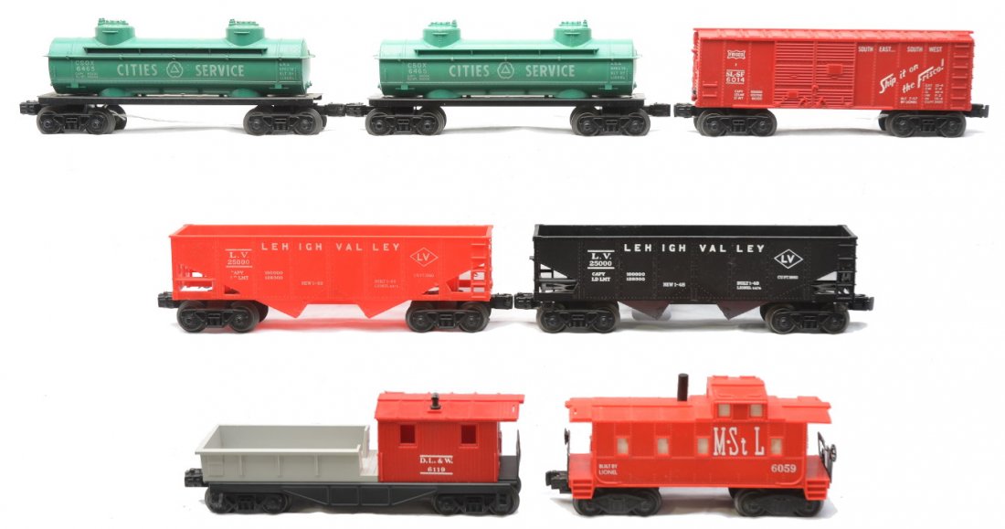 Lionel Freights 6014 6465 6476 6476 6119 6059: Lionel postwar freight cars including; 6014 Frisco boxcar, two 6465 green Cities Service two dome tanks, 6476 red Lehigh Valley hopper, 6476 black Lehigh Valley hopper, 6119 D.L.&W. work caboose and a