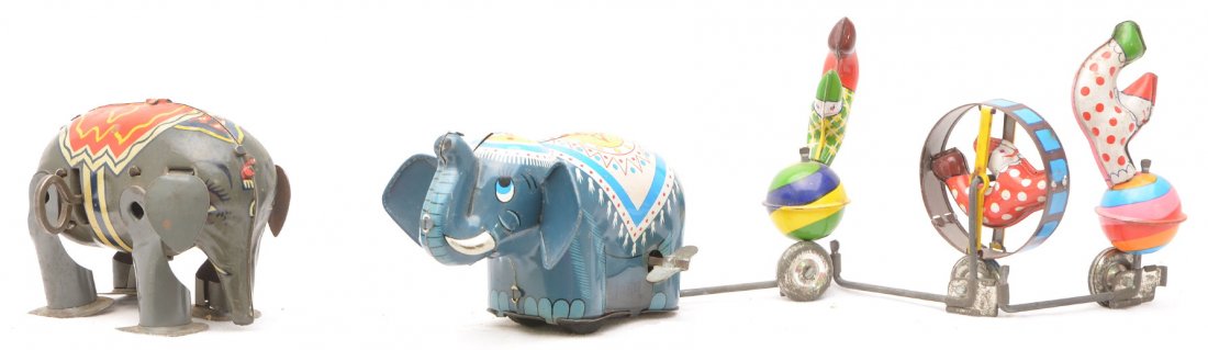 Tin Litho Elephant and Elephant with Clowns: Tin lithographed wind up elephant and a tin lithographed wind up elephant pulling three clowns, C7.