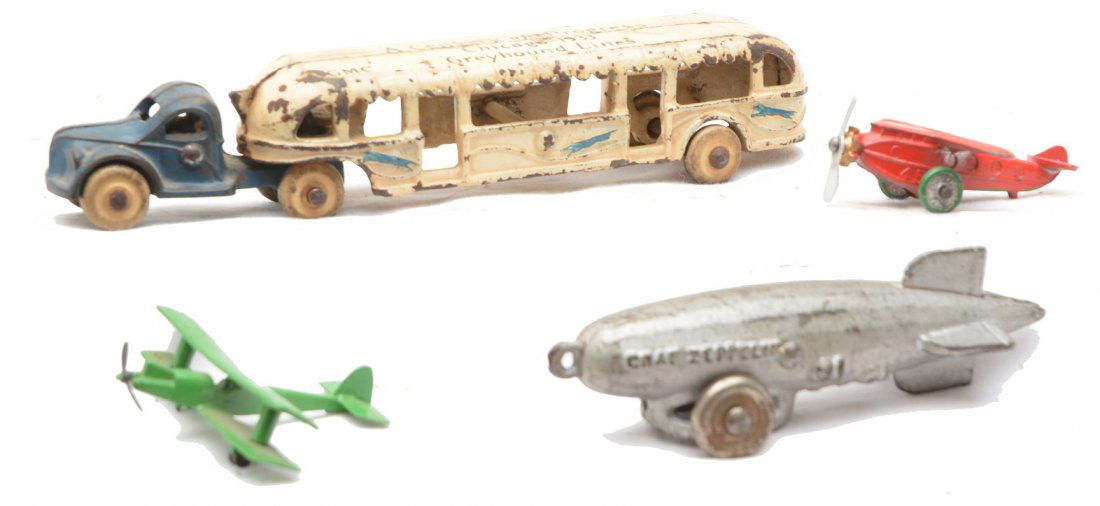 Cast Iron Graf Zeppelin Arcade Cast Iron Bus: Cast Iron Graf Zeppelin, Albatross die cast miniature toy plane with one set of wheels missing and a red die cast miniature airplane. The Zeppelin is C6 and the other two planes are C7. Also included