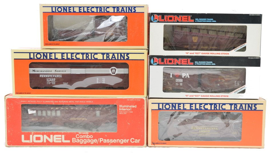 Lionel PRR 16317 17220 19709 19807 19906 LN OBs: Lionel Pennsylvania freight cars including; 16317 barrel ramp car, 17220 merchandise car, 19709 work caboose with smoke and illuminated interior, 19807 extended vision caboose and a 19906 I Love Penns