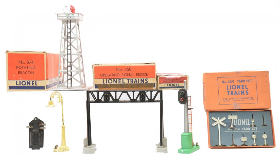 Lionel Accessories 309 153 450 384 Boxed: Lionel postwar accessories including; 153 automatic black signal and control, 309 yard set missing two signs and one sign is missing the base, 450 operating signal bridge with a 153C contactor and 384