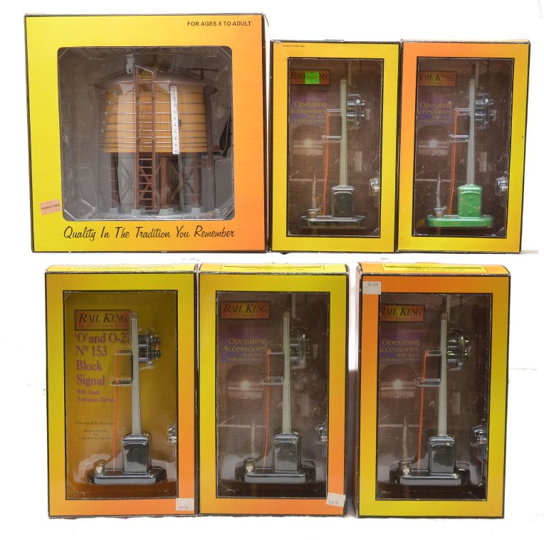 RK MTH four 30-1076 RK-1034 30-11028 OBs: Rail King by MTH accessories; four 30-1076 no. 153 block signals with black bases, RK-1034 no. 153 block signal with a green base and a 30-11028 water tower all in OBs. The accessories have shelf dust
