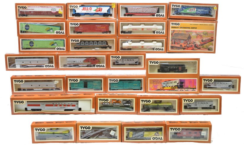 Tyco HO Scale SF Engine Selection of Freight Cars: Tyco HO scale Santa Fe engines, one Santa Fe passenger car and a large selection of freight cars, freight unloading depot and hopper car unloading set all in OBs, C8.