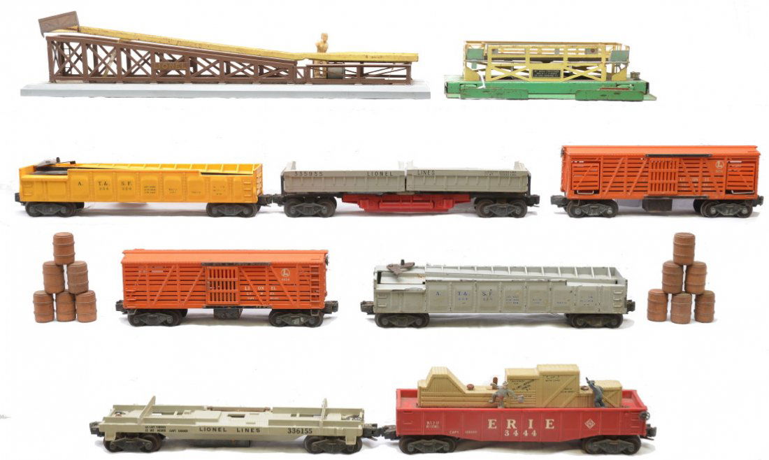 Lionel 3361-55 3359-55 3444 3656 362 3562-25: Lionel freight cars; 3361-55 log dump car missing logs, 3359-55 twin bin coal dump car, 3444 Erie operating gondola and two 3656 cattle cars with one corral. Also included is a 362 barrel loader that