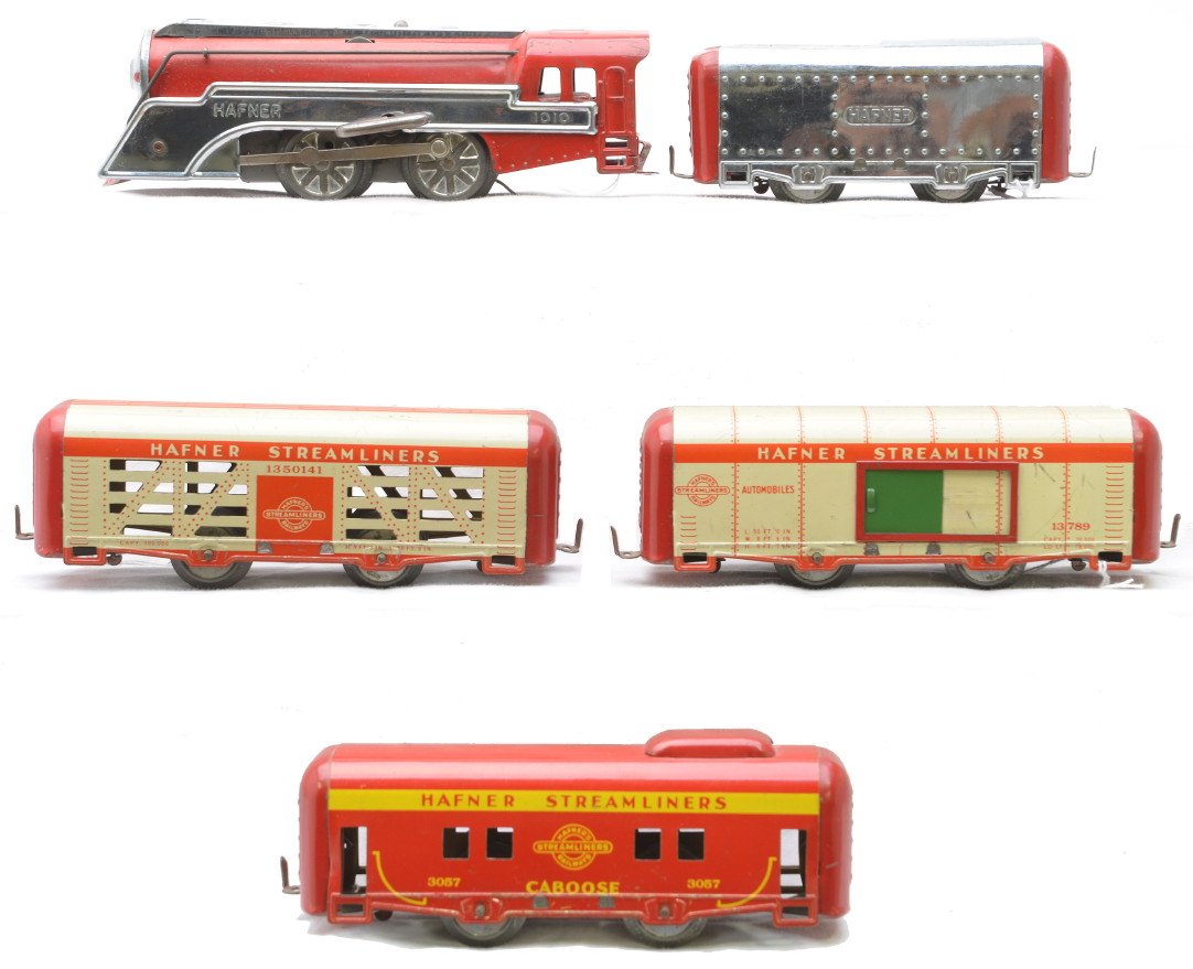 Hafner Lithographed Streamlined Freight Set: Hafner lithographed streamlined freight set including; 1010 red 0-4-0 clockwork steam loco and tender with chrome trim, 13789 automobile, 1350141 cattle car and a 3057 caboose. Set is C6-7.