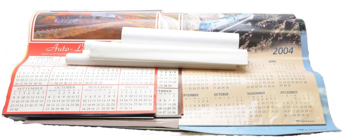 Selection of PRR and Amtrak Calendars: Selection of Pennsylvania Railroad calendars from the following years; two 1977s and two 1980s. Also included are Amtrak wall calendars from 1972-2005 and an Amtrak poster. All calendars are or will b