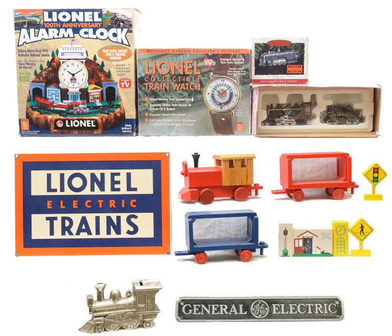 Lionel Clock Watch Ornament Misc. Accessories: Lionel 100th Anniversary alarm clock, collectible train watch and a Hallmark Keepsake Ornament all in OBs. Also included is an Enesco Lionel salt and pepper set in OB, metal Lionel Electric Trains sig