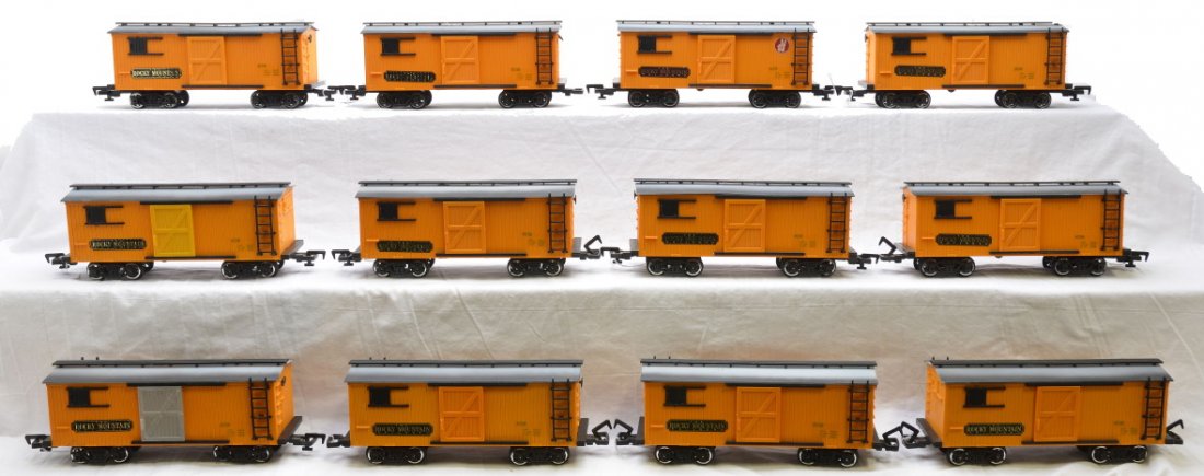 New Bright G Scale 12-Yellow RM Boxcars: New Bright G scale twelve yellow Rocky Mountain boxcars, C7. Please allow for shipping charges on this lot.