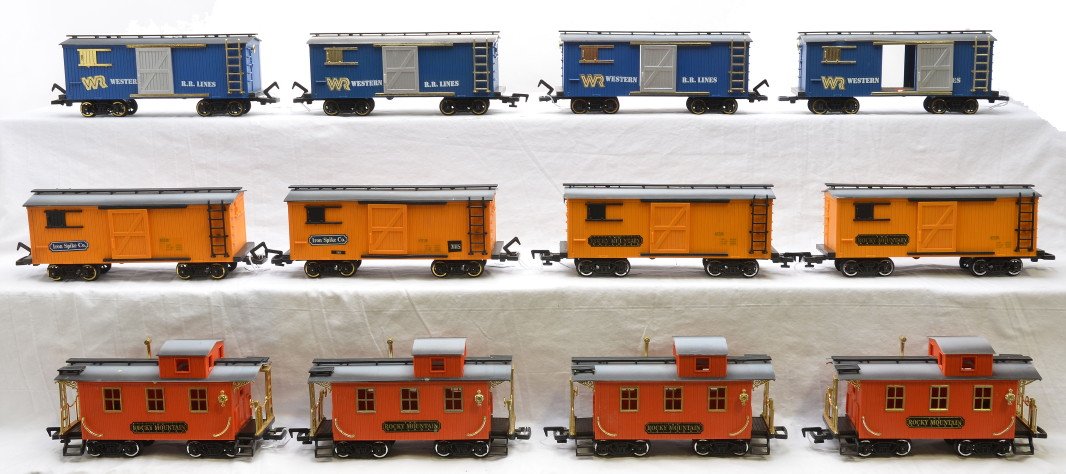 New Bright 4-WRR 2-RM 2-IS Boxcars 4-Cabooses: New Bright G scale four blue Western R.R. Lines boxcars, two yellow Rocky Mountain boxcars, two yellow Iron Spike boxcars and four orange Rocky Mountain cabooses, C7. Please allow for shipping charges