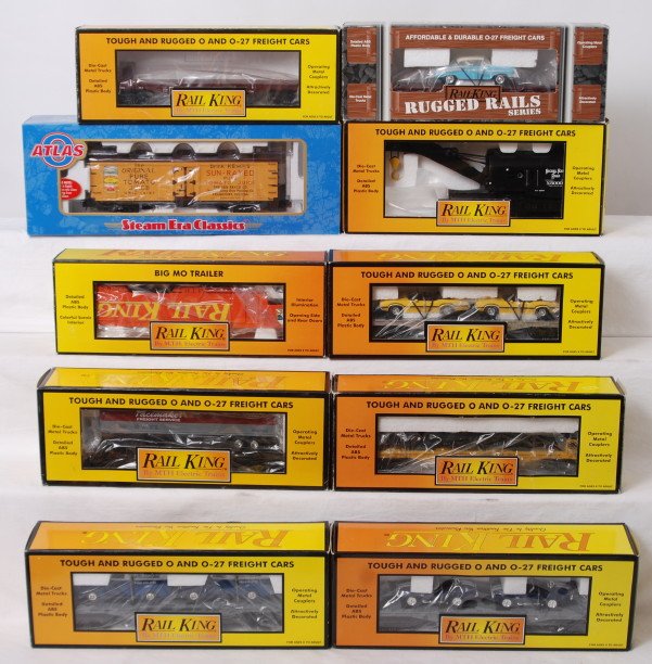 10 Railking and Atlas O freight cars: MTH Railking and Atlas O modern O gauge freight cars in OBs. Ten cars include 7602 Southern Pacific flat with Chevy, 7665 Pennsylvania flat, 7660 auto transport with Cobras, 7608 New York Central flat
