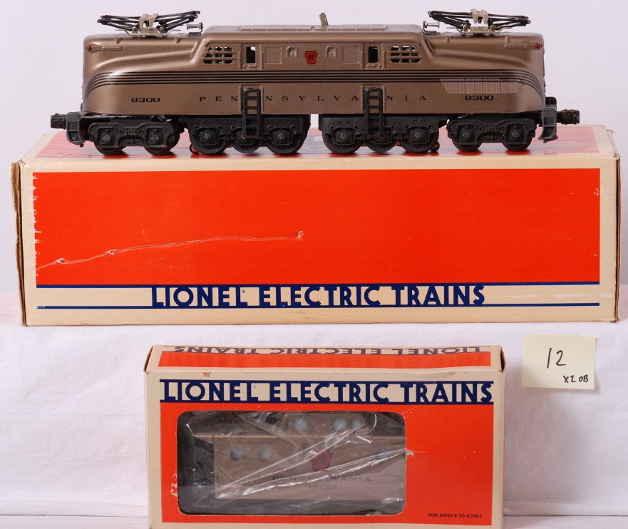 Lionel PRR Mint Series 18300 GG-1 and caboose: Lionel modern O gauge Pennsylvania Mint Series; 18300 GG-1 in OB. Loco is C7 condition, light rust on ladders, and some light spotting on paint. Also included is 19702 Pennsylvania caboose. OBs have s