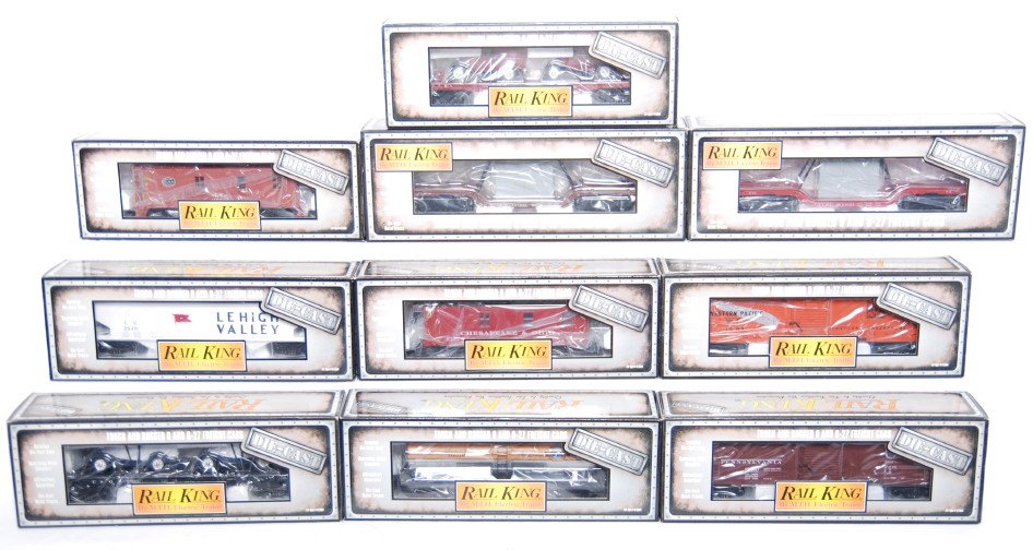 10 Railking diecast freight cars 8301, 8302, 8002,: MTH Railking modern O gauge die cast freight cars in OBs. Ten cars include 8304 Chesapeake and Ohio flat with vans, 8501 New York Central caboose, 8301 Santa Fe depressed flat with transformer, 8302 I