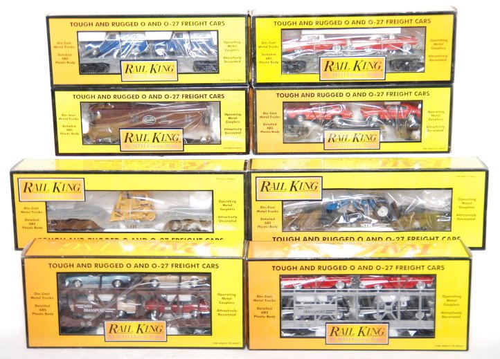 8 Railking freight cars 7638, 7656, 7618, 7721, et: MTH Railking modern O gauge freight cars in OBs. Eight cars include 7656 auto transport with ChevyÕs, 7638 auto transport with Firebirds, 7610 flat with ChevyÕs, 7622 flat with New Holland tractor, 