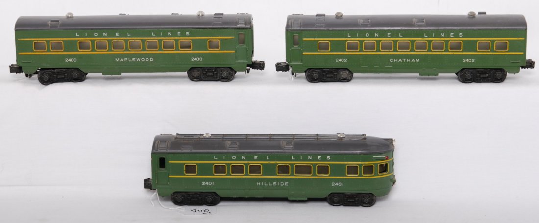 Lionel 2400, 2401, 2402 green passenger cars: Postwar Lionel O gauge passenger cars, 2400 Maplewood Pullman passenger coach (appears to contain original inspection slip), 2401 Hillside observation, and 2402 Chatham Pullman passenger coach, trains