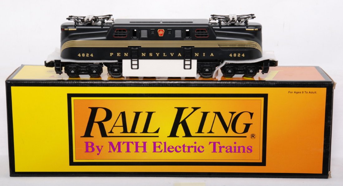 Railking Pennsylvania GG-1 with horn: MTH Railking modern O gauge 30-2506 Pennsylvania Brunswick five stripe GG-1 in OB. Loco features horn and is high C9 with no signs of running beyond a factory test. OB has price stickers.